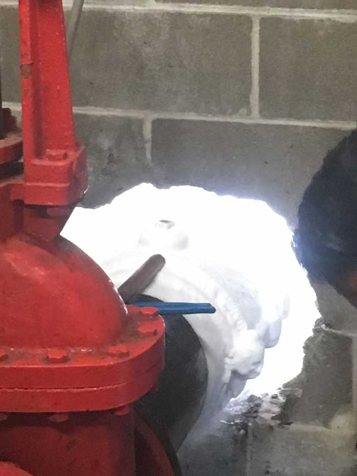 10" Pipe Freeze Plug in a Tight Location Half Outside and Inside Close to a Valve  in Houston, TX